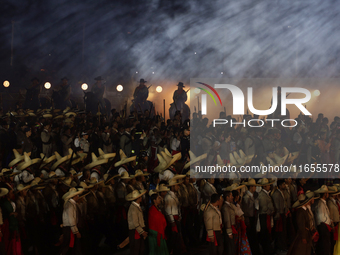 A performance and commemorative ceremony of the 200th anniversary of the Mexican Republic takes place in the Zocalo of Mexico City, Mexico,...