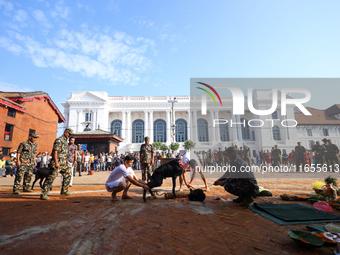 GRAPHIC WARNING: Nepal Army personnel sacrifice a he-goat in Kathmandu Durbar Square on the final day of Nawaratri in Kathmandu, Nepal, on O...