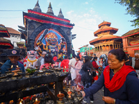 A Nepali Hindu devotee offers prayers to Kaal Bhairav in Kathmandu Durbar Square in Kathmandu, Nepal, on October 11, 2024, on the final day...