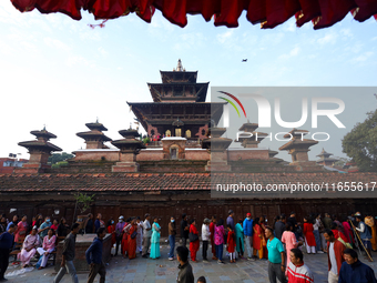 Nepali Hindu devotees stand in a queue to reach the Taleju Bhawani Temple in Kathmandu Durbar Square, Nepal, on October 11, 2024, on the fin...