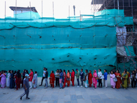 Nepali Hindu devotees stand in a queue to reach the Taleju Bhawani Temple in Kathmandu Durbar Square, Nepal, on October 11, 2024, on the fin...