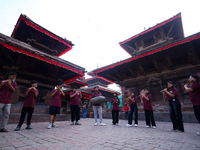 A chorus of a local musical band plays music in Basantapur Durbar Square, Nepal, on October 11, 2024. (