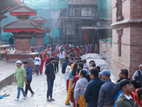 Nepali Hindu devotees stand in a queue to reach the Taleju Bhawani Temple in Kathmandu Durbar Square, Nepal, on October 11, 2024, on the fin...