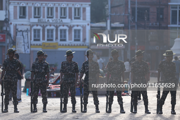 Nepal Army personnel stand guard in the courtyard of Kathmandu Durbar Square as the procession for the day of Nawaratri, also called Maha Na...