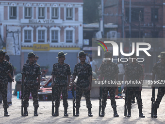 Nepal Army personnel stand guard in the courtyard of Kathmandu Durbar Square as the procession for the day of Nawaratri, also called Maha Na...