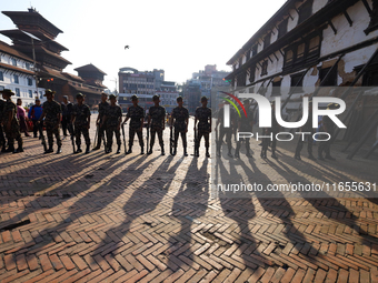 Nepal Army personnel stand guard in the courtyard of Kathmandu Durbar Square as the procession for the day of Nawaratri, also called Maha Na...