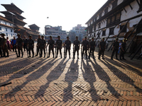 Nepal Army personnel stand guard in the courtyard of Kathmandu Durbar Square as the procession for the day of Nawaratri, also called Maha Na...