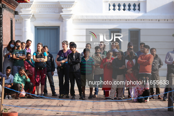 People watch the Maha Nawami procession at Kathmandu Durbar Square in Kathmandu, Nepal, on October 11, 2024, the final day of Navaratri. 