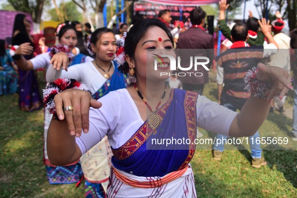 Mising tribal girls perform a traditional dance during the Ali-Aye-Ligang festival in Nagaon district, Assam, India, on February 15, 2023. A...