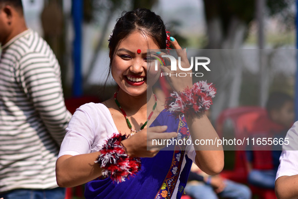 Mising tribal girls perform a traditional dance during the Ali-Aye-Ligang festival in Nagaon district, Assam, India, on February 15, 2023. A...