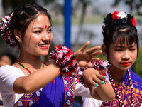 Mising tribal girls perform a traditional dance during the Ali-Aye-Ligang festival in Nagaon district, Assam, India, on February 15, 2023. A...