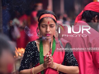 Devotees offer prayer at the Kamakhya temple for the Hindu festival of Navratri in Guwahati, India, on October 2, 2022. (