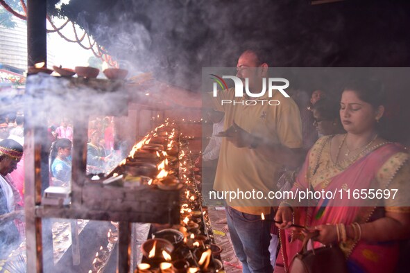 Devotees offer prayer at the Kamakhya temple for the Hindu festival of Navratri in Guwahati, India, on October 2, 2022. 