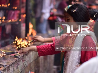 Devotees offer prayer at the Kamakhya temple for the Hindu festival of Navratri in Guwahati, India, on October 2, 2022. (