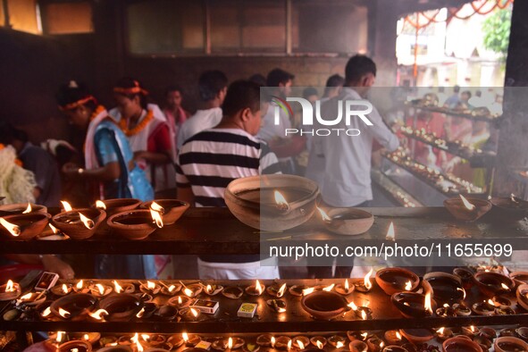 Devotees offer prayer at the Kamakhya temple for the Hindu festival of Navratri in Guwahati, India, on October 2, 2022. 