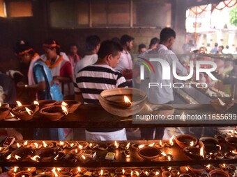 Devotees offer prayer at the Kamakhya temple for the Hindu festival of Navratri in Guwahati, India, on October 2, 2022. (