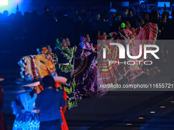 Participants perform a show during the ceremony commemorating the 200th anniversary of the Mexican Republic in Mexico City, Mexico, on Octob...