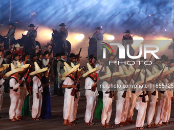 Participants perform a show during the ceremony commemorating the 200th anniversary of the Mexican Republic in Mexico City, Mexico, on Octob...