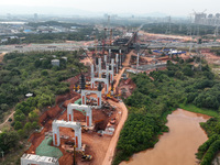 Construction workers work on the Nanchang-Jiujiang High-speed Railway Ganjiang River Highway and Railway Bridge, China's first 350 km/h mixe...