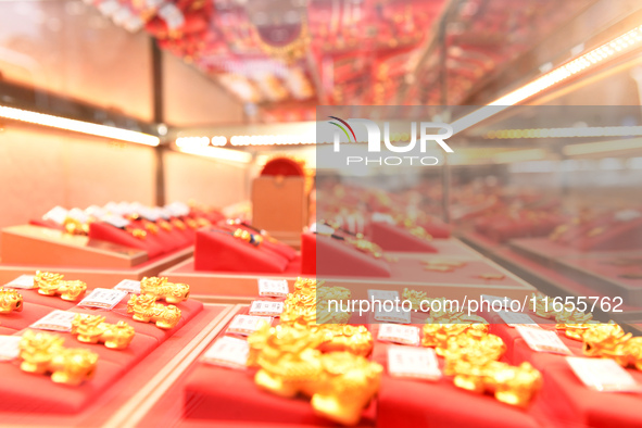 Gold ornaments are pictured at a gold shop in Renhuai, China, on October 11, 2024. 