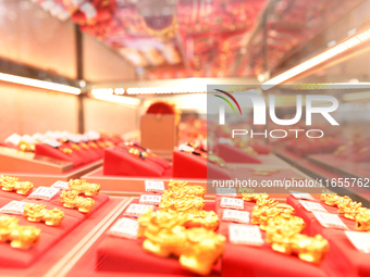 Gold ornaments are pictured at a gold shop in Renhuai, China, on October 11, 2024. (