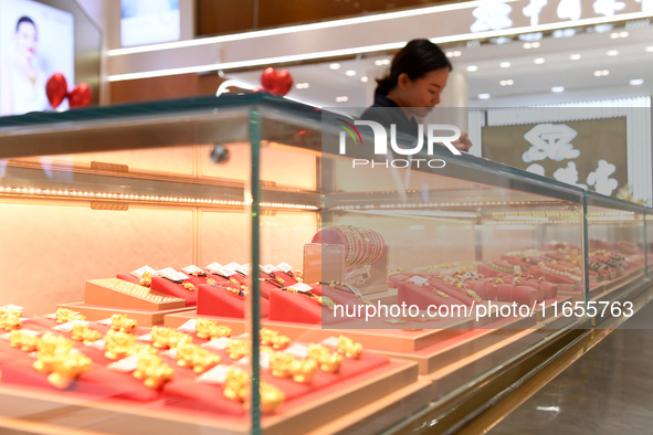 Gold ornaments are pictured at a gold shop in Renhuai, China, on October 11, 2024. 