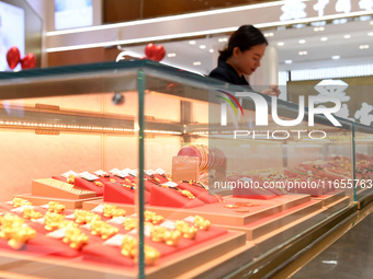 Gold ornaments are pictured at a gold shop in Renhuai, China, on October 11, 2024. (