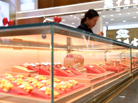 Gold ornaments are pictured at a gold shop in Renhuai, China, on October 11, 2024. (