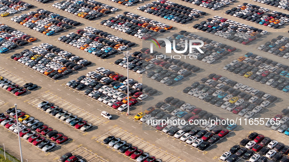 Vehicles parked at an automobile manufacturer are about to be shipped to the market in Ningde, China, on October 10, 2024. 