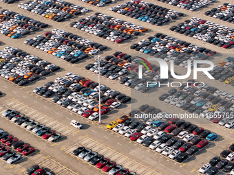 Vehicles parked at an automobile manufacturer are about to be shipped to the market in Ningde, China, on October 10, 2024. (