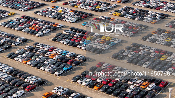 Vehicles parked at an automobile manufacturer are about to be shipped to the market in Ningde, China, on October 10, 2024. 