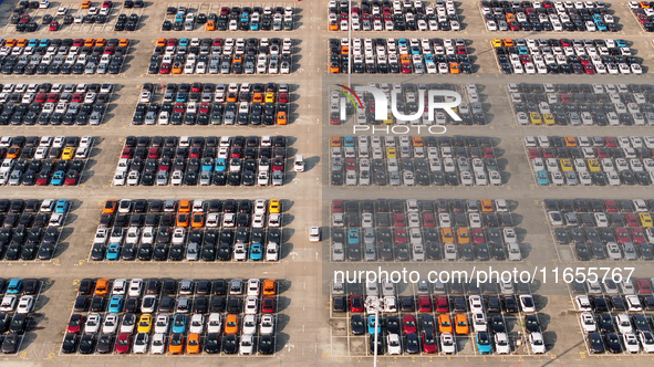 Vehicles parked at an automobile manufacturer are about to be shipped to the market in Ningde, China, on October 10, 2024. 