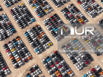 Vehicles parked at an automobile manufacturer are about to be shipped to the market in Ningde, China, on October 10, 2024. (