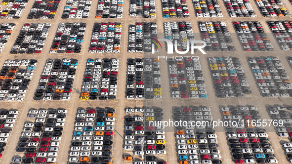 Vehicles parked at an automobile manufacturer are about to be shipped to the market in Ningde, China, on October 10, 2024. 