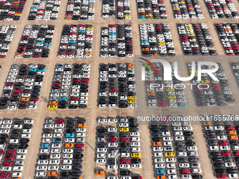 Vehicles parked at an automobile manufacturer are about to be shipped to the market in Ningde, China, on October 10, 2024. (