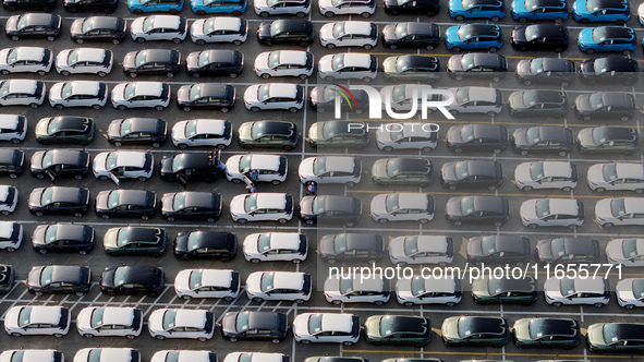 Vehicles parked at an automobile manufacturer are about to be shipped to the market in Ningde, China, on October 10, 2024. 