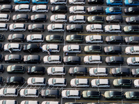 Vehicles parked at an automobile manufacturer are about to be shipped to the market in Ningde, China, on October 10, 2024. (