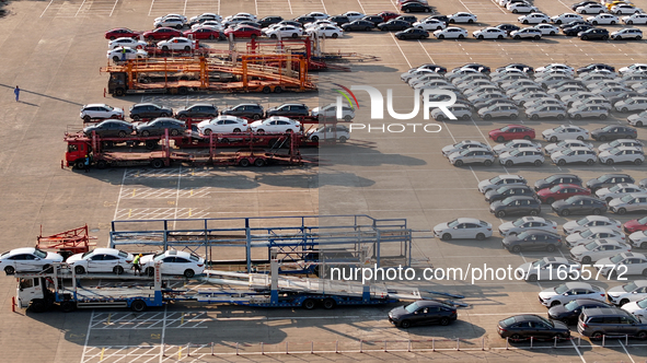 Vehicles parked at an automobile manufacturer are about to be shipped to the market in Ningde, China, on October 10, 2024. 