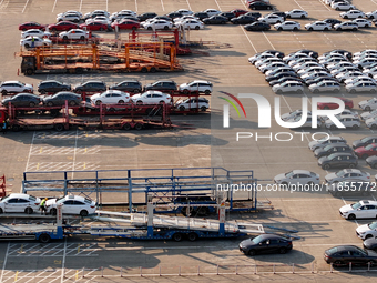 Vehicles parked at an automobile manufacturer are about to be shipped to the market in Ningde, China, on October 10, 2024. (