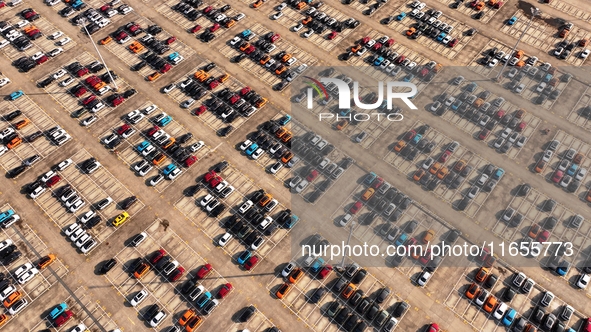 Vehicles parked at an automobile manufacturer are about to be shipped to the market in Ningde, China, on October 10, 2024. 