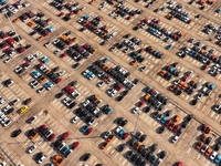 Vehicles parked at an automobile manufacturer are about to be shipped to the market in Ningde, China, on October 10, 2024. (