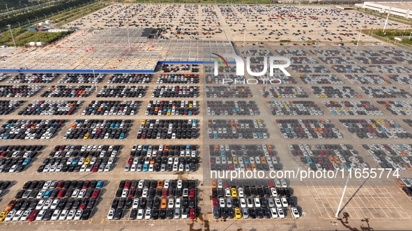 Vehicles parked at an automobile manufacturer are about to be shipped to the market in Ningde, China, on October 10, 2024. 