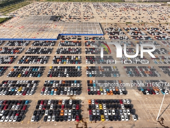 Vehicles parked at an automobile manufacturer are about to be shipped to the market in Ningde, China, on October 10, 2024. (