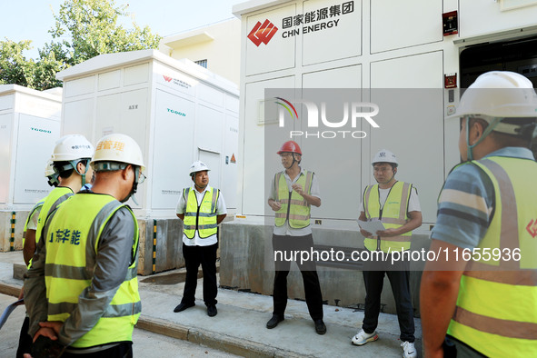 Engineers arrange tasks before grid connection for power supply in Liuzhou, China, on October 10, 2024. 