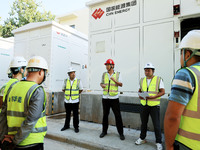 Engineers arrange tasks before grid connection for power supply in Liuzhou, China, on October 10, 2024. (