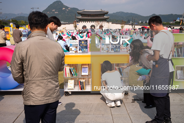 Citizens at the Gwanghwamun Square Book Fair in Seoul, South Korea, on October 11, 2024, view books by Han Kang, the South Korean author who...