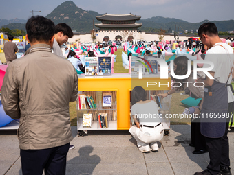 Citizens at the Gwanghwamun Square Book Fair in Seoul, South Korea, on October 11, 2024, view books by Han Kang, the South Korean author who...