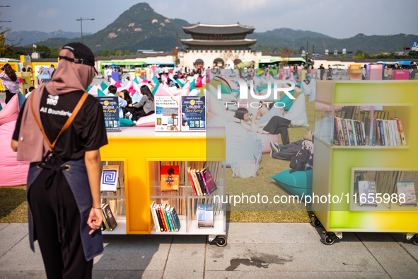 Citizens at the Gwanghwamun Square Book Fair in Seoul, South Korea, on October 11, 2024, view books by Han Kang, the South Korean author who...