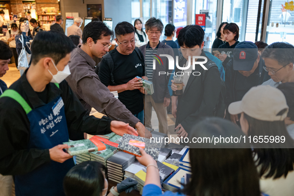 Citizens purchase books by novelist Han Kang, the 2024 Nobel Prize winner in Literature, at Kyobo Bookstore in Gwanghwamun, Jongno-gu, Seoul...