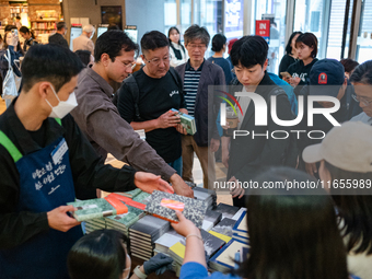 Citizens purchase books by novelist Han Kang, the 2024 Nobel Prize winner in Literature, at Kyobo Bookstore in Gwanghwamun, Jongno-gu, Seoul...